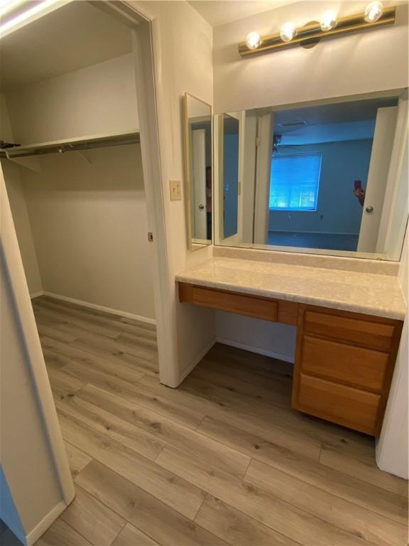 6217 Patrick Henry Dr, Hopewell Twp Bea, PA 15001 - bathroom featuring wood finished floors, vanity, and a spacious closet