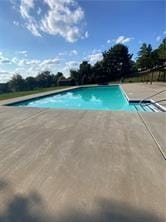 pool with a patio area