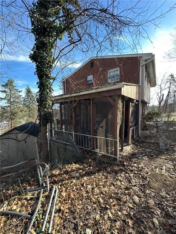 back of property featuring a sunroom