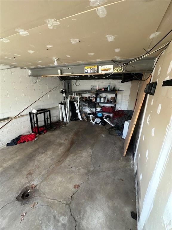garage with concrete block wall