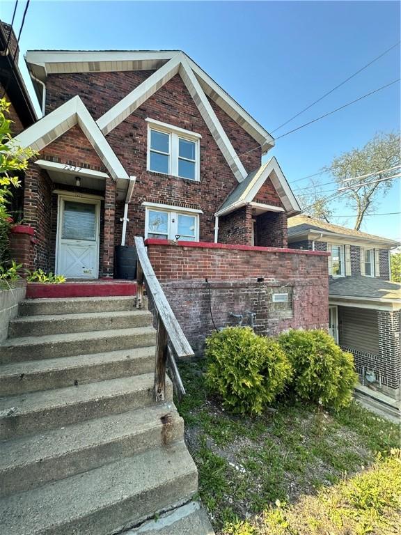 view of front of property with brick siding