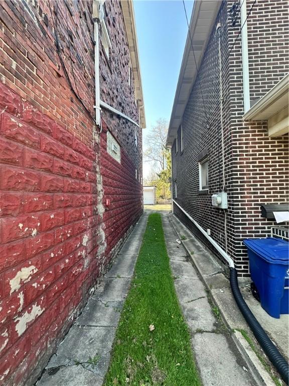 view of property exterior featuring brick siding