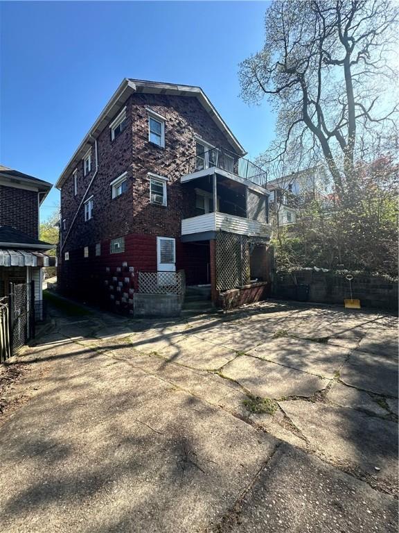 rear view of house with a balcony