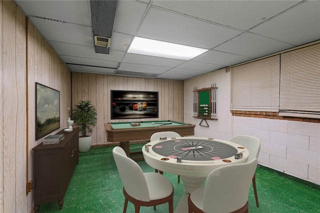 recreation room featuring concrete block wall, billiards, wood walls, and a paneled ceiling