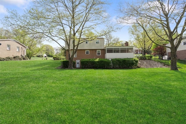 view of yard featuring a sunroom