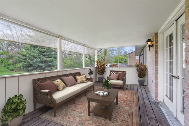 wooden deck with french doors and an outdoor living space