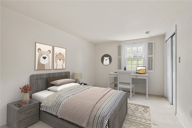 bedroom featuring light carpet