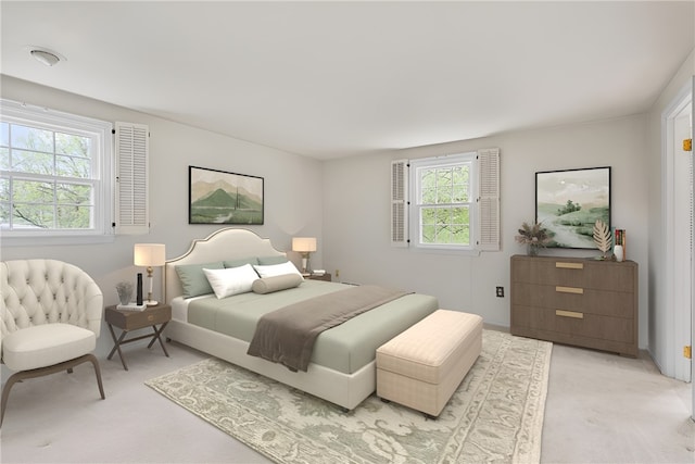 bedroom featuring light carpet