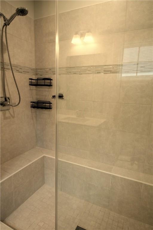 full bath featuring a stall shower