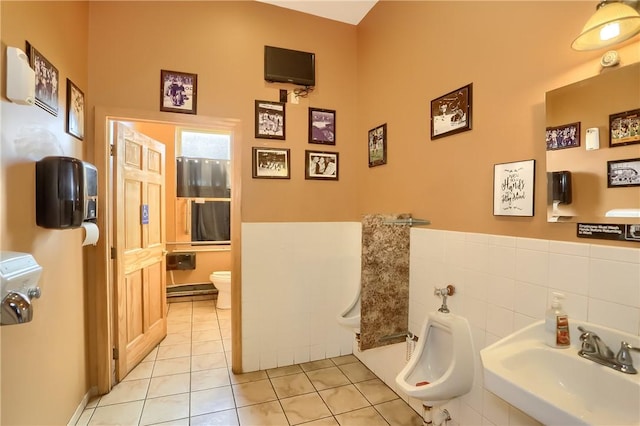 400 Duss Ave, Ambridge, PA 15003 - bathroom featuring a sink, tile patterned floors, toilet, and tile walls