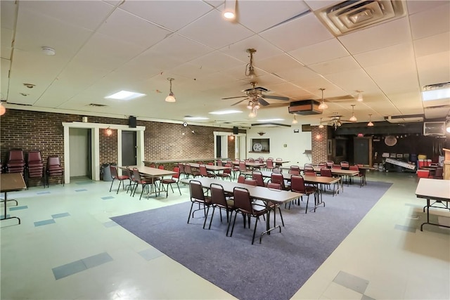400 Duss Ave, Ambridge, PA 15003 - dining space with a ceiling fan, brick wall, and visible vents