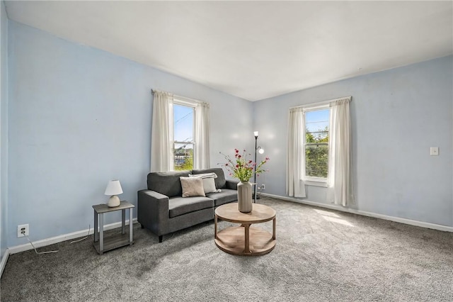 living area with plenty of natural light, carpet flooring, and baseboards