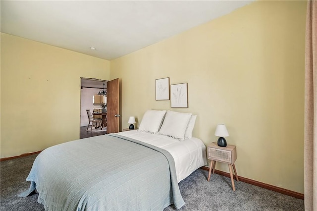 carpeted bedroom with baseboards