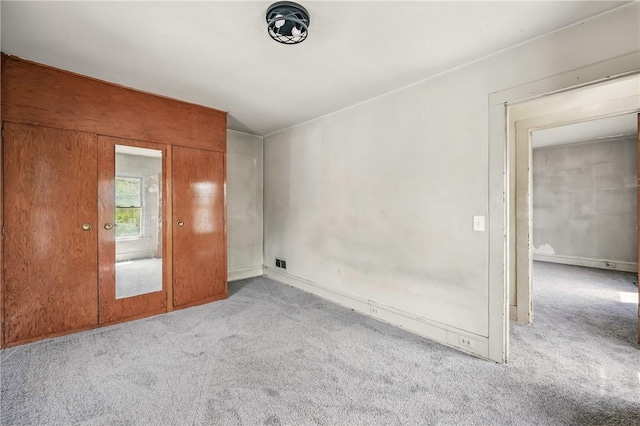 carpeted spare room with visible vents