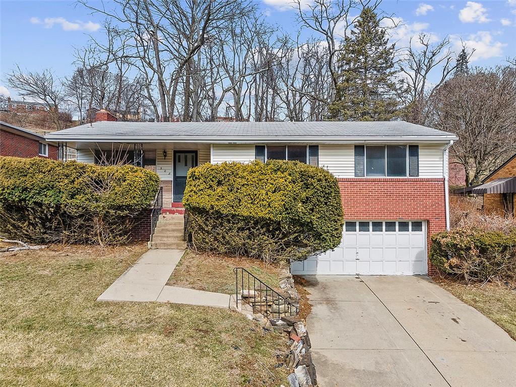 508 Dunn Dr, Whitehall, PA 15227 - ranch-style house featuring concrete driveway, brick siding, an attached garage, and a front lawn