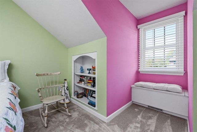 carpeted bedroom with baseboards and vaulted ceiling