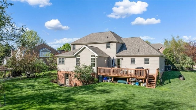 back of property featuring a lawn, a wooden deck, and cooling unit