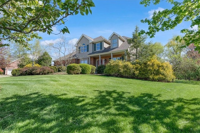 view of home's exterior featuring a lawn and brick siding