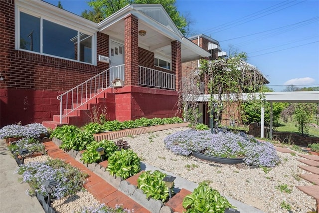 view of front of home featuring brick siding