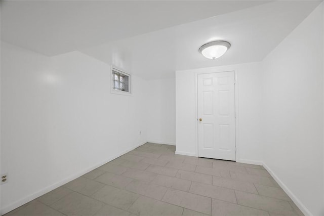 finished basement featuring baseboards