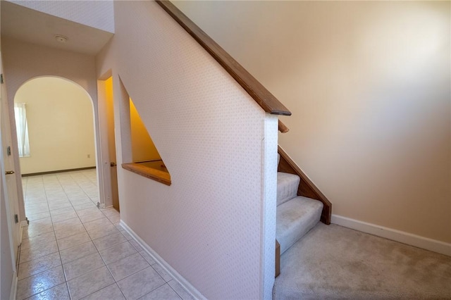1437 Yorktown Dr, Cecil, PA 15055 - stairs featuring baseboards, arched walkways, and tile patterned floors