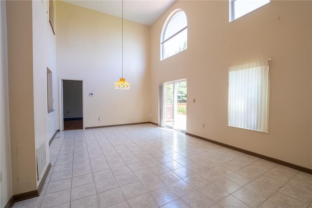 1437 Yorktown Dr, Cecil, PA 15055 - empty room featuring light tile patterned floors, baseboards, a high ceiling, and visible vents