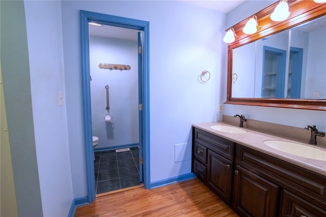 1437 Yorktown Dr, Cecil, PA 15055 - full bath with a sink, toilet, double vanity, and wood finished floors