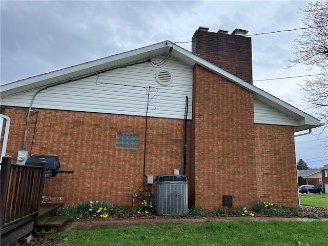 246 Anderson Ave, Indiana Boro Ind, PA 15701 - view of side of property featuring central air condition unit, a chimney, and brick siding
