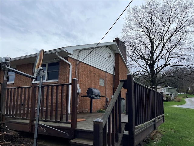 246 Anderson Ave, Indiana Boro Ind, PA 15701 - view of home's exterior with a wooden deck, a yard, and brick siding