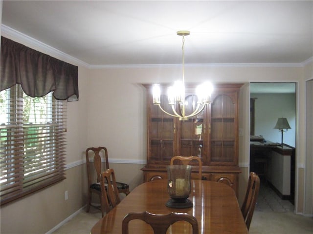 dining space with crown molding and a chandelier
