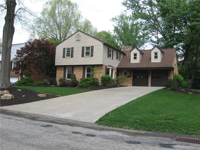 view of front facade featuring brick siding, a front lawn, and driveway