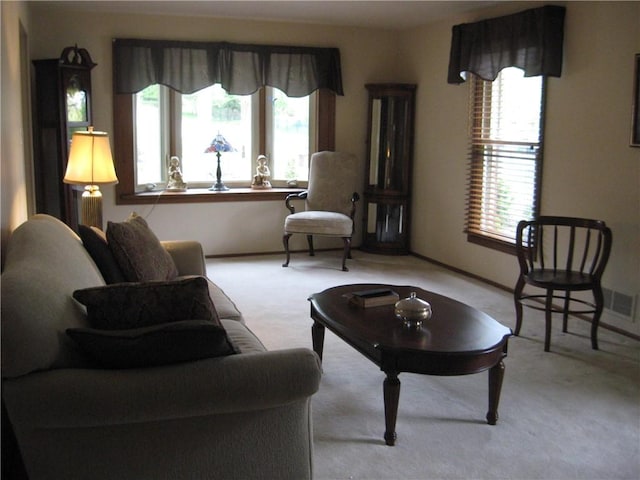 living room with carpet floors and baseboards