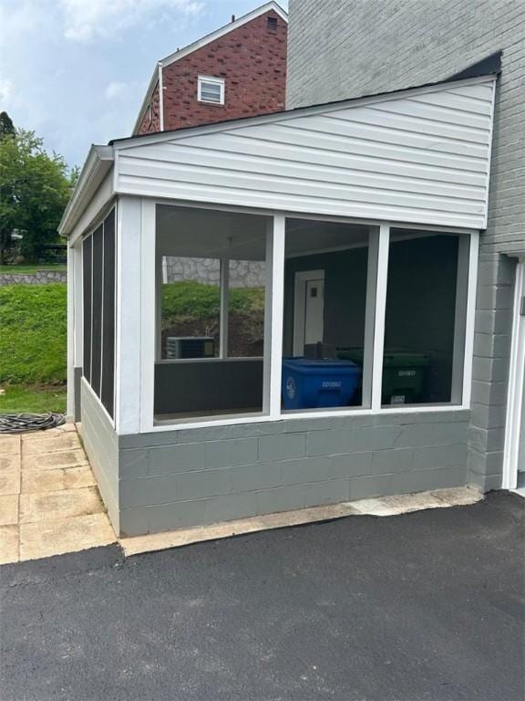 view of home's exterior featuring a sunroom