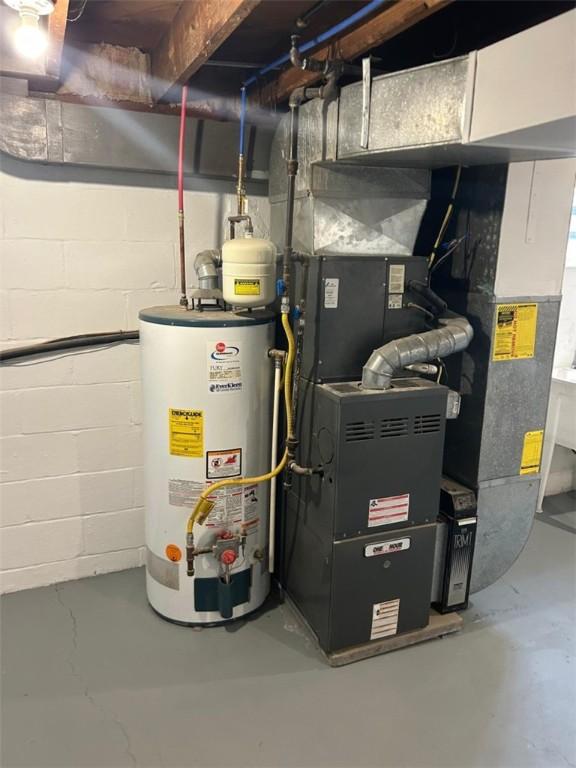 utility room featuring gas water heater