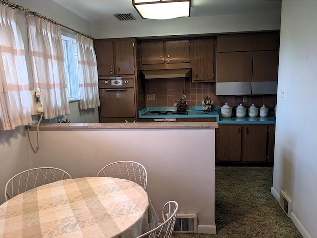 211 Wainwright Dr, Mckeesport, PA 15132 - kitchen featuring oven, visible vents, decorative backsplash, and carpet
