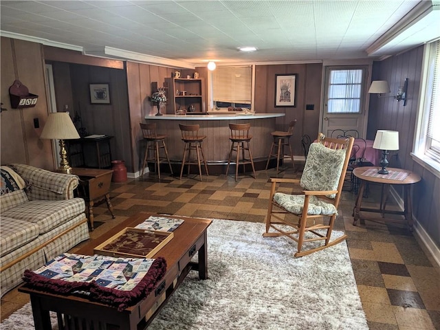 211 Wainwright Dr, Mckeesport, PA 15132 - living area featuring wooden walls, baseboards, and a dry bar