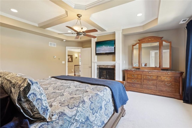 bedroom featuring carpet flooring, visible vents, a glass covered fireplace, and coffered ceiling