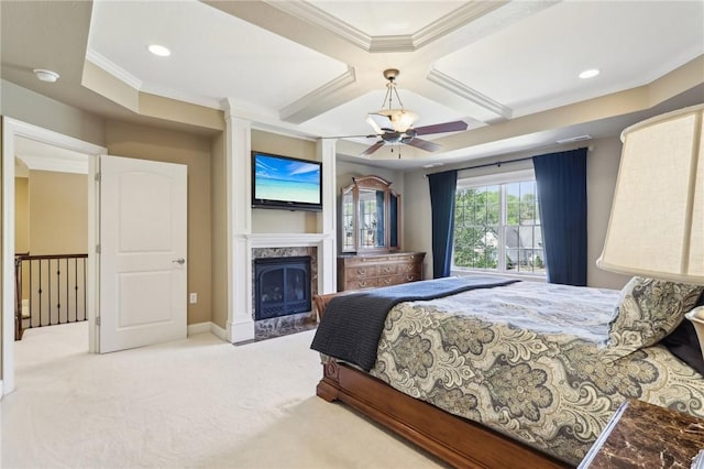 bedroom with crown molding, beam ceiling, coffered ceiling, carpet, and a premium fireplace