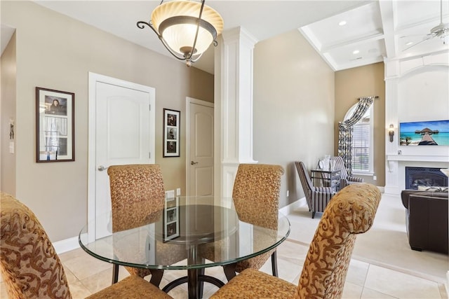 dining area featuring beamed ceiling, ornate columns, baseboards, and light tile patterned floors