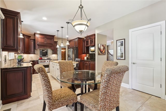 dining room featuring recessed lighting, baseboards, and light tile patterned floors