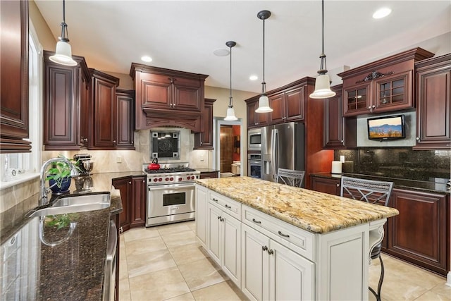 kitchen with decorative backsplash, a kitchen island, glass insert cabinets, a sink, and stainless steel appliances