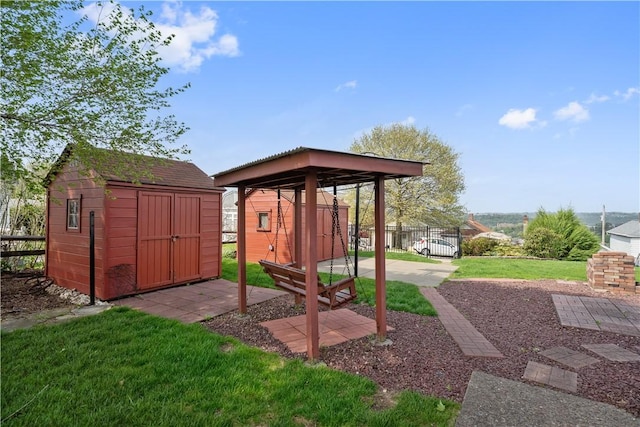 view of shed featuring fence