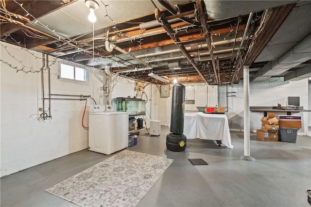 below grade area featuring washer / dryer and electric panel