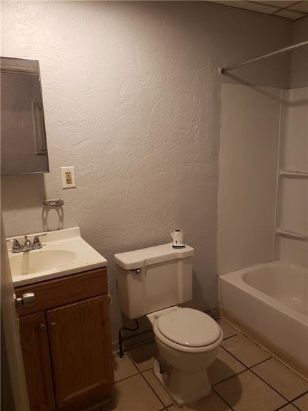 full bath featuring toilet, tile patterned floors, tub / shower combination, and vanity