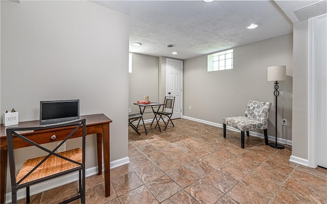 office with baseboards, recessed lighting, stone finish flooring, and visible vents