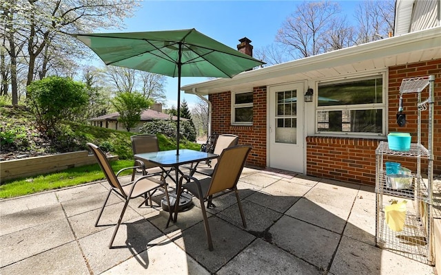 view of patio featuring outdoor dining area