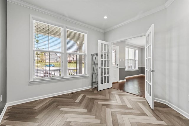 spare room featuring french doors, recessed lighting, baseboards, and crown molding