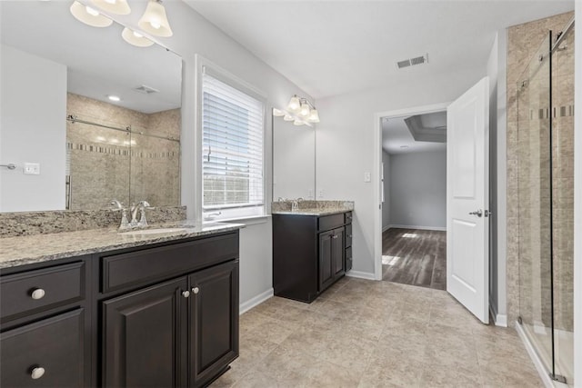 238 Gabriel Dr, Adams Twp, PA 16046 - full bathroom featuring a shower stall, two vanities, tile patterned flooring, and baseboards