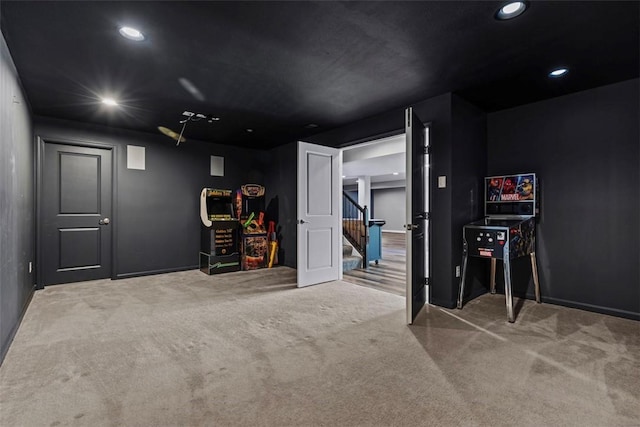carpeted home theater room with recessed lighting and baseboards