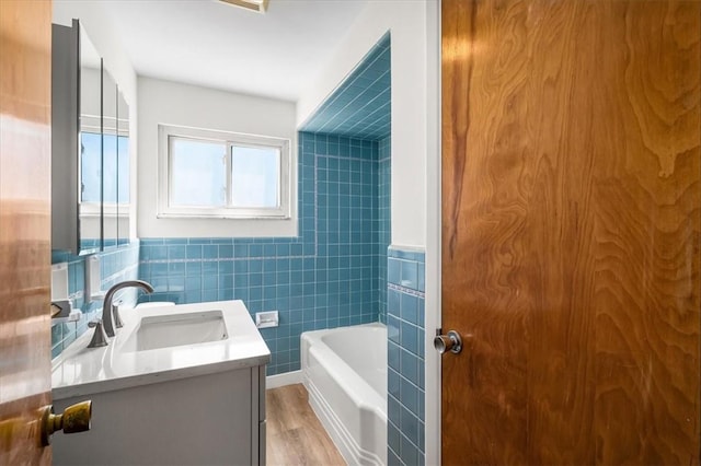 2410 Nicholson Rd, Franklin Park, PA 15143 - full bath with a washtub, tile walls, wood finished floors, and vanity